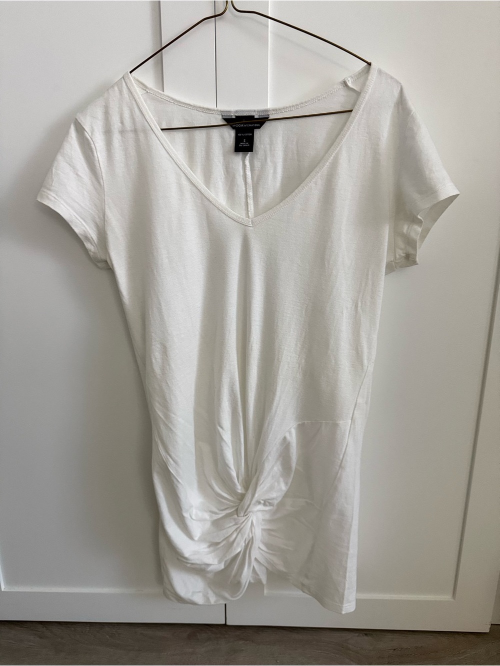 White Moda International V-Neck Twist Front Women’s Top.